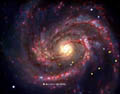 Imagen de SN 1979C: Imagen compuesta que muestra una supernova en la Galaxia M100. Crédito: X-ray: NASA/CXC/SAO/D.Patnaude et al, Optical: ESO/VLT, Infrared: NASA/JPL/Caltech.:left